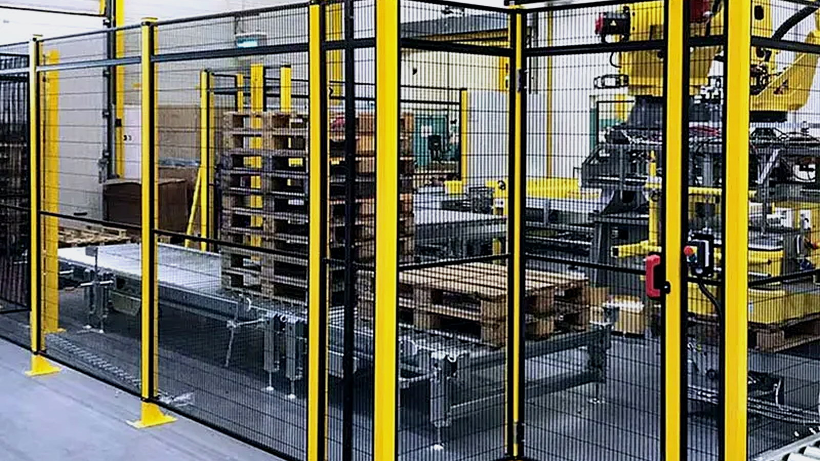 Installed perimeter guarding protecting an industrial robot cell