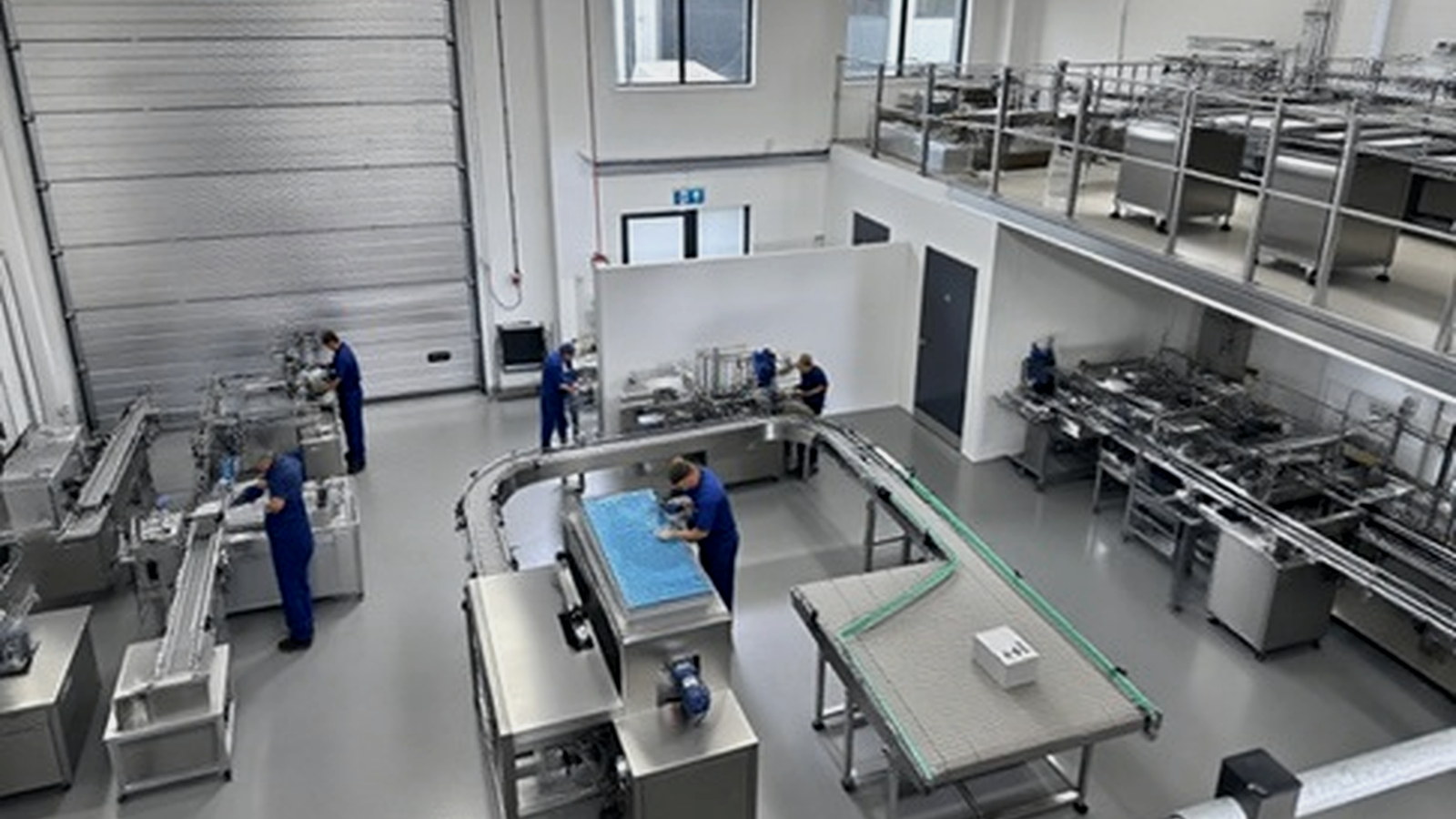 Operating packaging machinery and conveyors inside a production facility